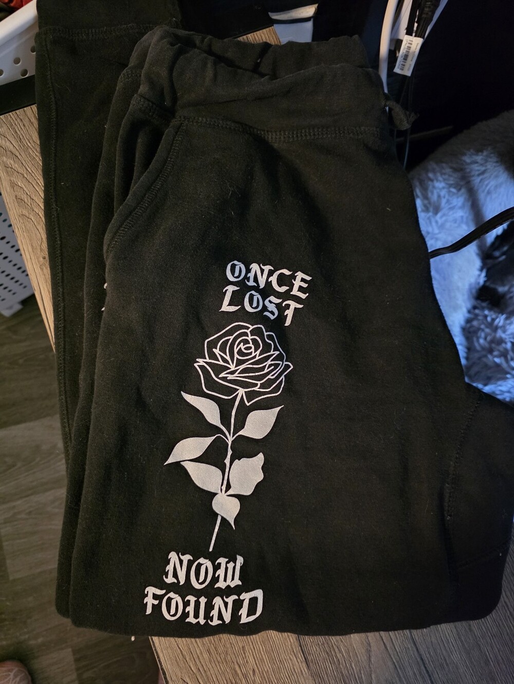 Black Graphic Sweatpants with 'Once Lost Now Found' Rose Print